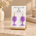 Boucles d’oreilles artisanales « Verres à pied scintillants » violettes